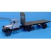 WHITE SEMI TRACTOR WITH FLAT BED TRAILER